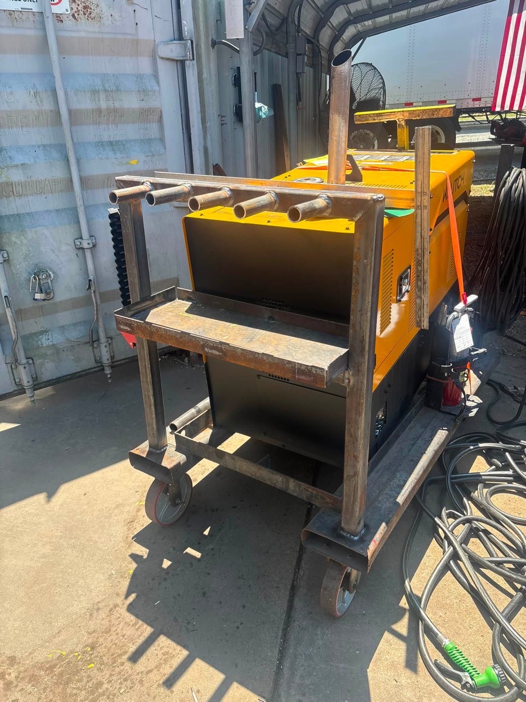 Custom welded torch and rod rack on the mobile rig